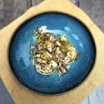 Roasted white radish with chili, garlic and nuts, topped with sesame seeds