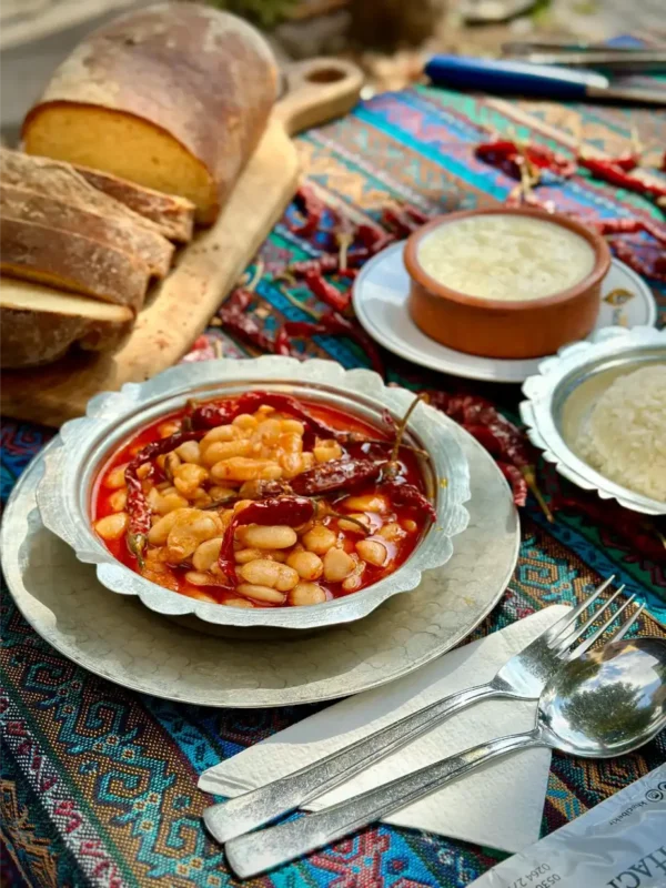 Delicious homemade bean stew served with sliced bread