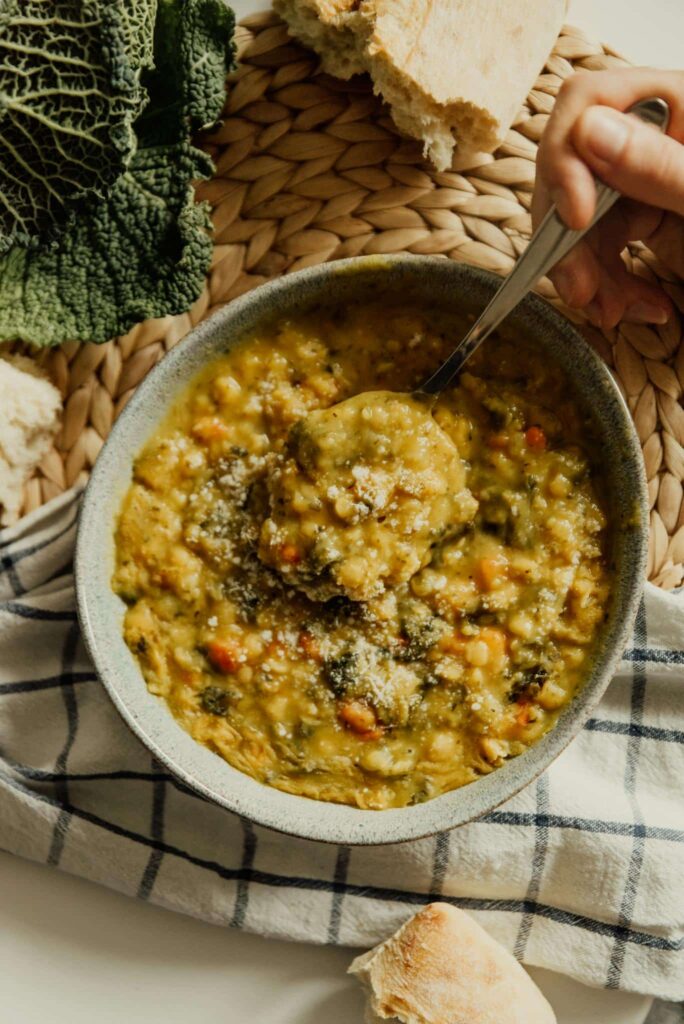 Delicious vegan lentil stew served in a bowl, rich in vegetables and flavors.