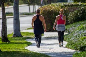 A couple walking outdoors to support digestion and gut health