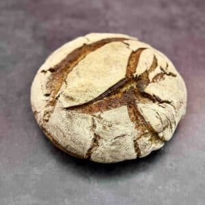freshly baked rye sourdough bread with walnuts and a rustic crust